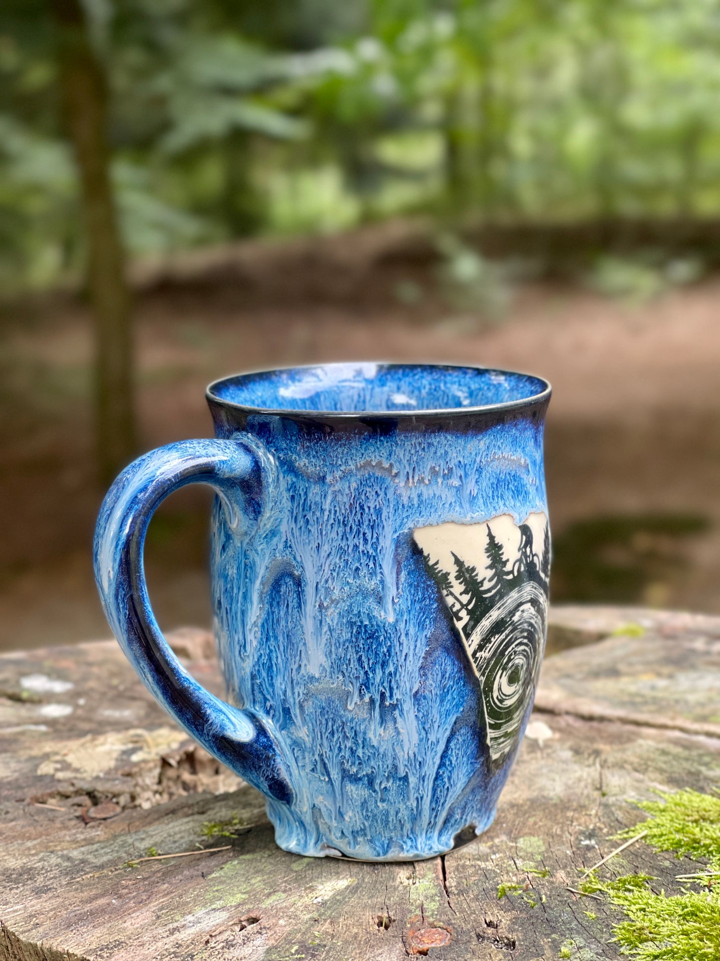 A large mug with a bicycle