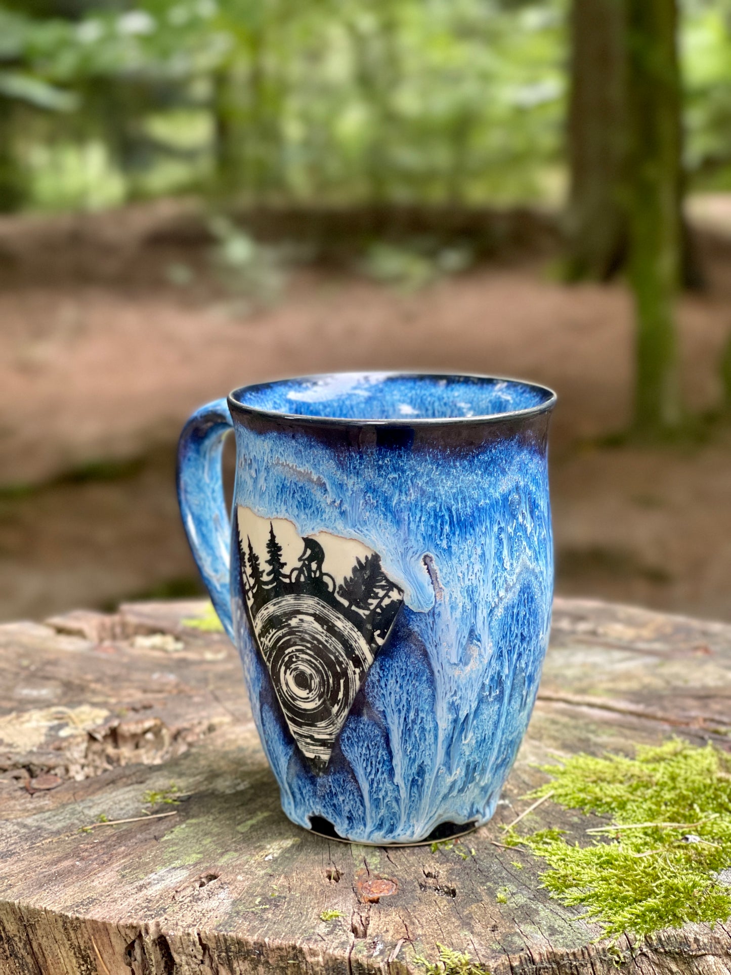 A large mug with a bicycle